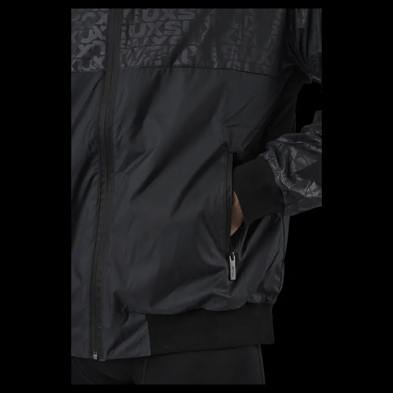 New 2XU Motion Windbreaker Embossed Monogram/slvr Reflect Svart